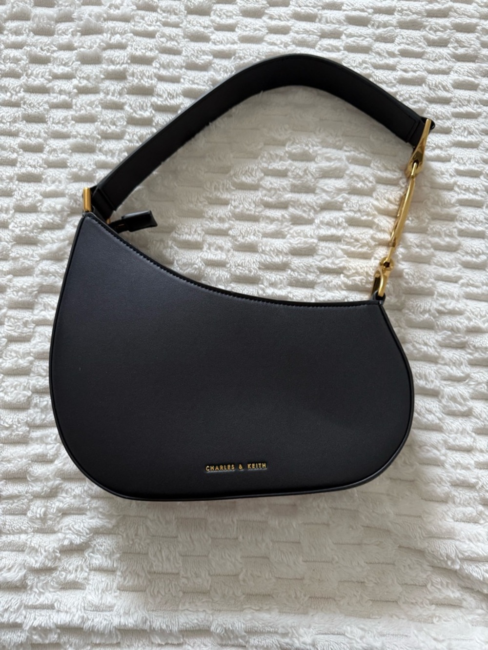 Charles & Keith Black Crescent Shoulder Bag with Gold Hardware